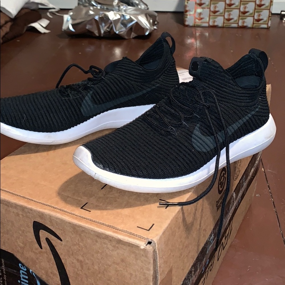 Black nike shoes with reflective back